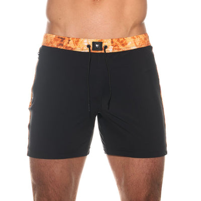 Close up of black Abyss mid leg swim trunks showing the smooth front and stretch fabric